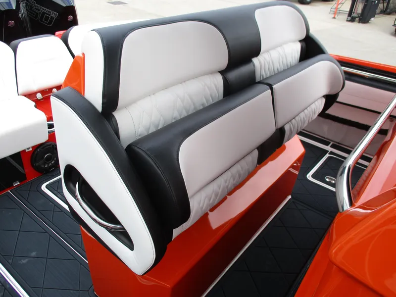 Slide: The Image of 2023 Nor-Tech 450 boat interior with stylish black and white seating. - 44