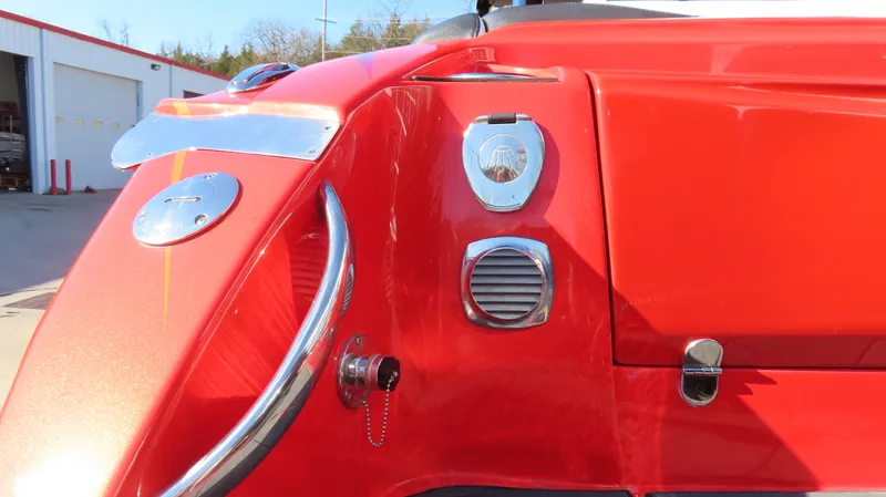 Slide: The Image of Red 2023 Nor-Tech 450 boat detail with chrome accents and sleek design elements. - 5