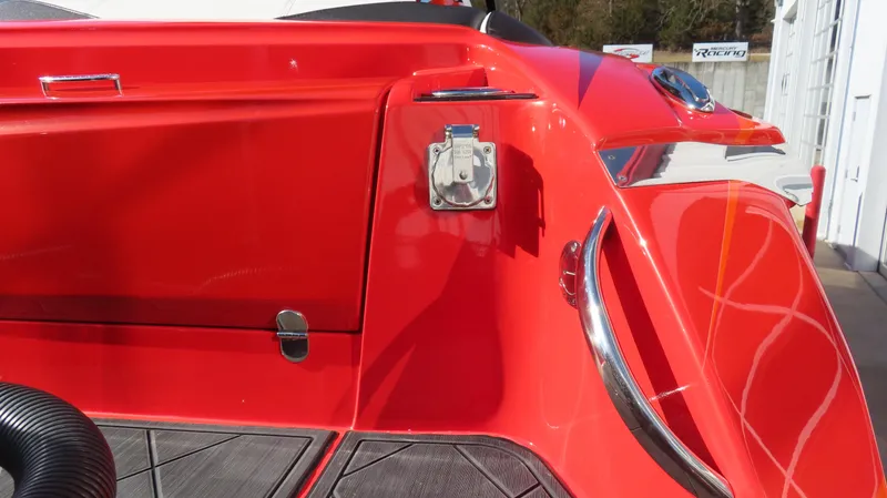 Slide: The Image of Red 2023 Nor-Tech 450 boat detail with sleek design and chrome accents. - 7