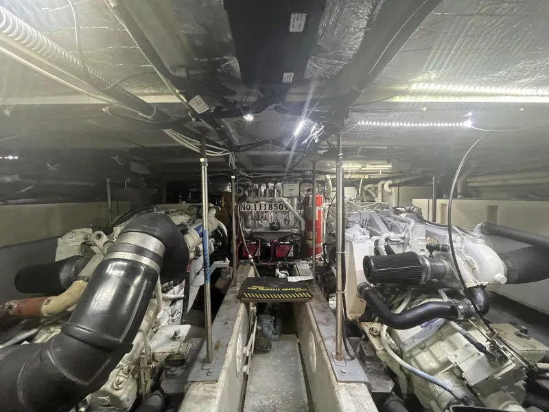 Slide: The Image of Engine room of a 1999 Carver 530 Voyager Pilothouse, showcasing mechanical components and systems. - 39