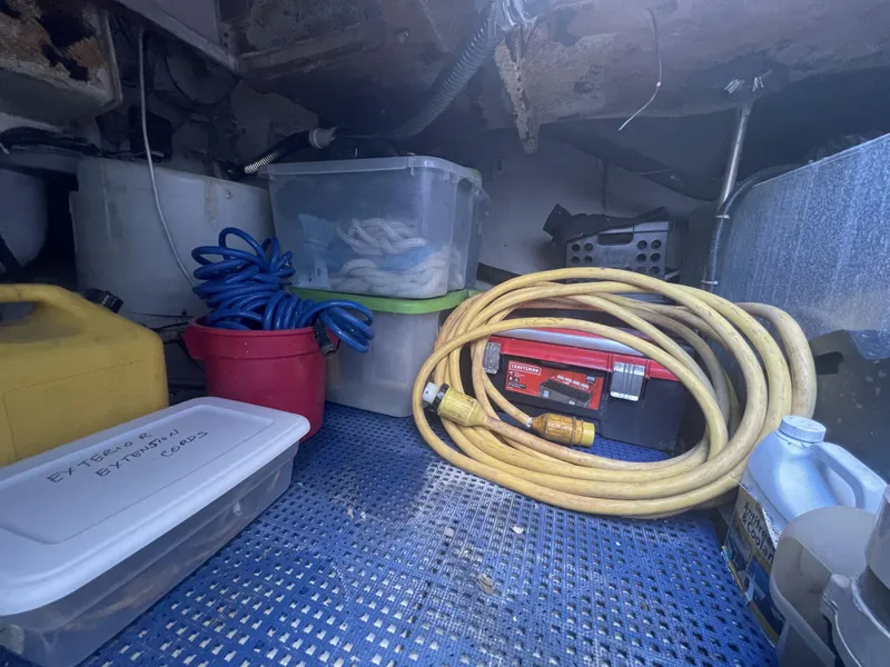 Slide: The Image of Storage area in a 1999 Carver 530 Voyager Pilothouse with hoses and containers. - 42