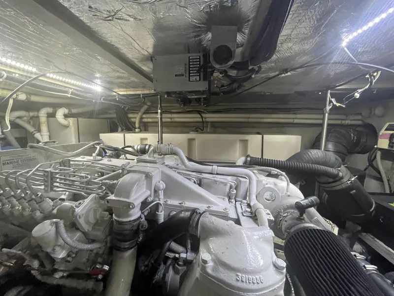 Slide: The Image of Engine room of 1999 Carver 530 Voyager Pilothouse with visible machinery and components. - 45