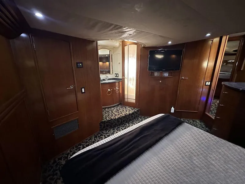 Slide: The Image of Luxurious interior of 1999 Carver 530 Voyager Pilothouse with wood paneling and modern amenities. - 24