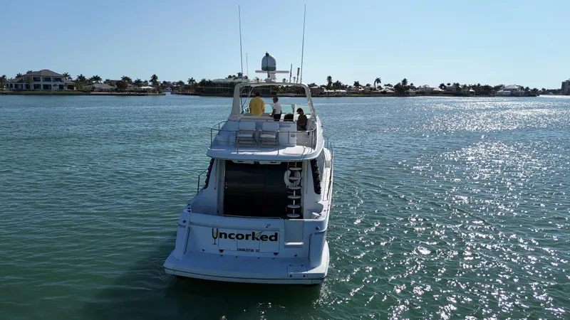 Slide: The Image of 1999 Carver 530 Voyager Pilothouse yacht cruising on a sunny day. - 7