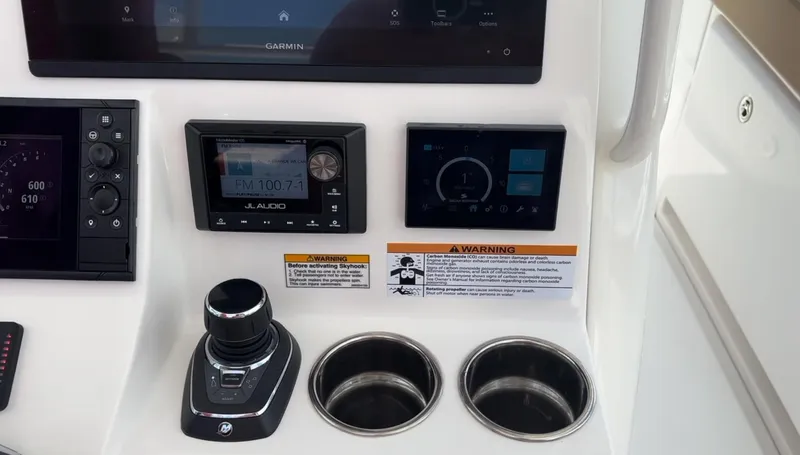 Slide: The Image of Control panel of 2023 Caymas 341 CC boat with navigation and audio systems. - 25