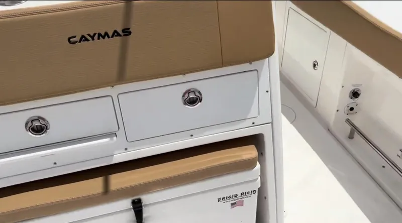 Slide: The Image of 2023 Caymas 341 CC boat interior with storage compartments and seating. - 30