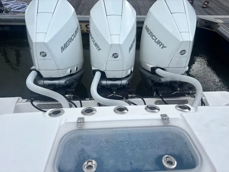 Slide: The Image of 2023 Caymas 341 CC boat with triple Mercury outboard engines at dock. - 37