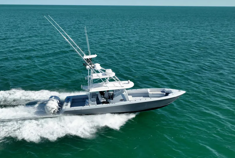 Slide: The Image of 2022 Contender 44 ST boat cruising on open sea, showcasing sleek design and powerful performance. - 1