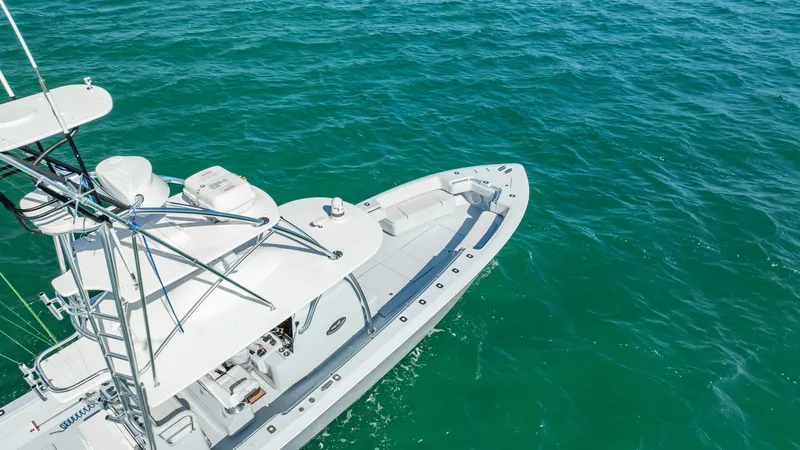 Slide: The Image of 2022 Contender 44 ST boat on clear turquoise water, aerial view. - 16