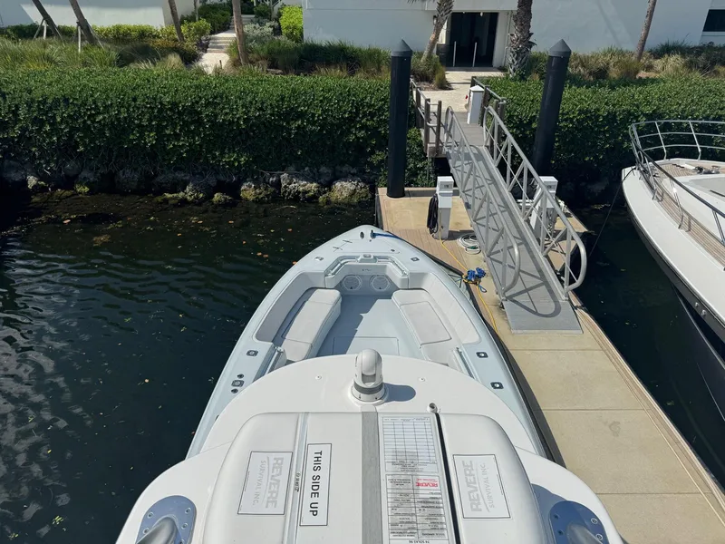 Slide: The Image of 2022 Contender 44 ST boat docked at marina, viewed from above. - 17