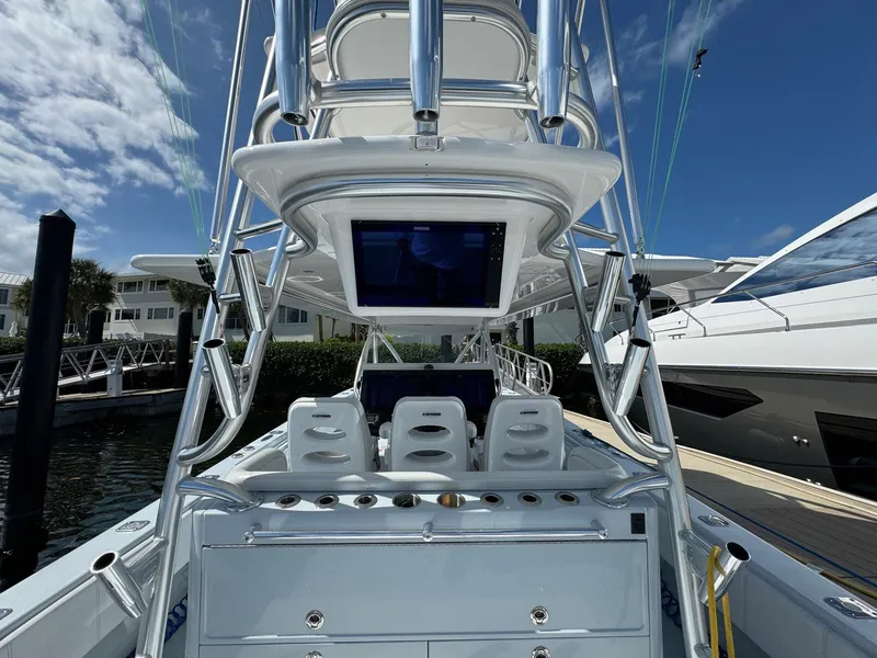 Slide: The Image of 2022 Contender 44 ST boat with sleek design and advanced navigation equipment. - 21