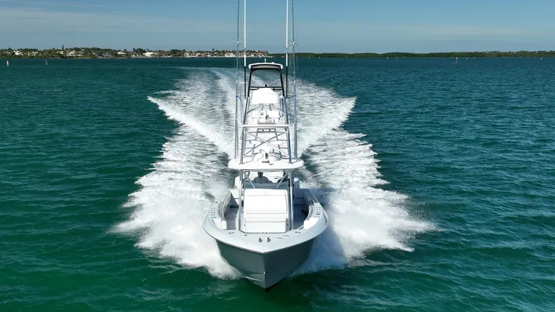 Slide: The Image of 2022 Contender 44 ST boat cruising on open water, creating a dynamic wake. - 3