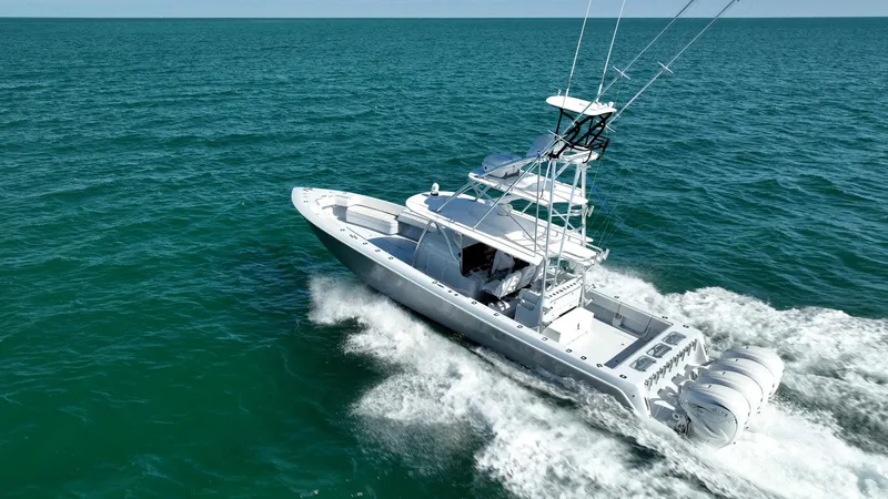 Slide: The Image of 2022 Contender 44 ST boat cruising on open ocean waters. - 30