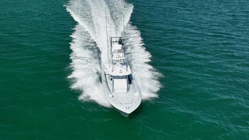 Slide: The Image of 2022 Contender 44 ST boat cruising on open water, aerial view. - 31