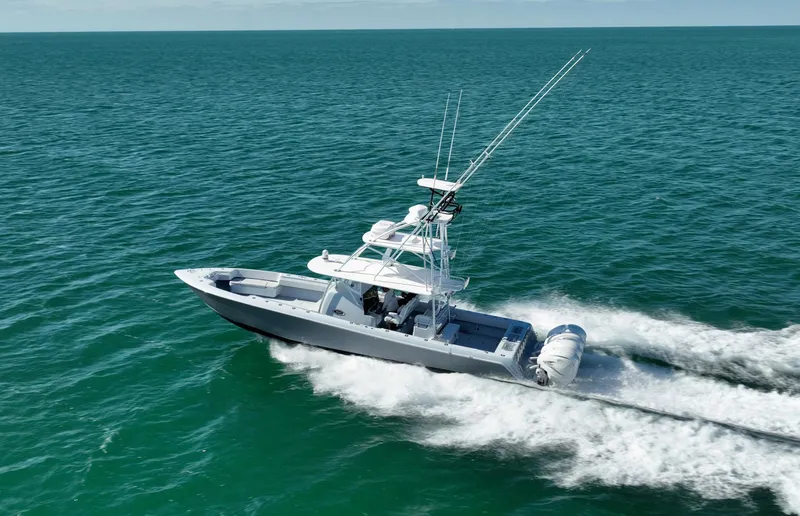 Slide: The Image of 2022 Contender 44 ST boat cruising on open ocean waters. - 5