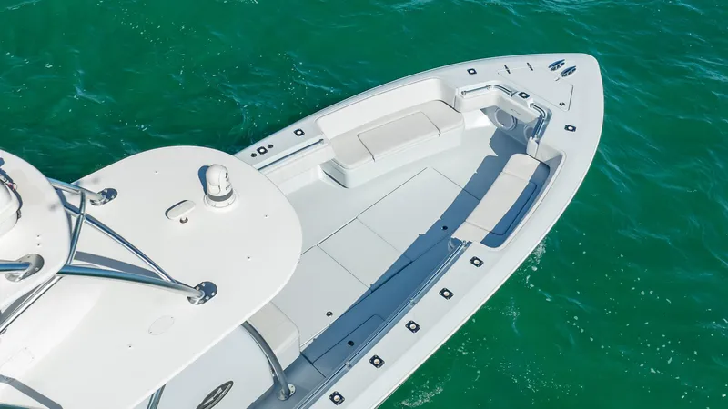 Slide: The Image of 2022 Contender 44 ST boat on clear turquoise water, aerial view. - 6