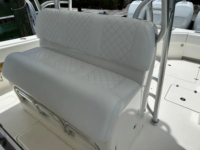 Slide: The Image of 2018 SeaVee 390Z boat with white cushioned seating and diamond stitching. - 11
