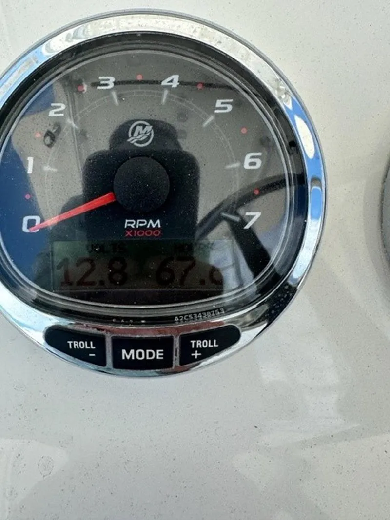 Slide: The Image of Close-up of 2018 SeaVee 390Z RPM gauge displaying 12.8 and 67.9 readings. - 26