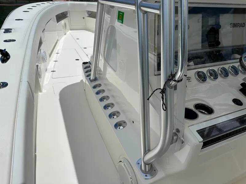Slide: The Image of 2018 SeaVee 390Z boat interior with control panel and stainless steel railings. - 8