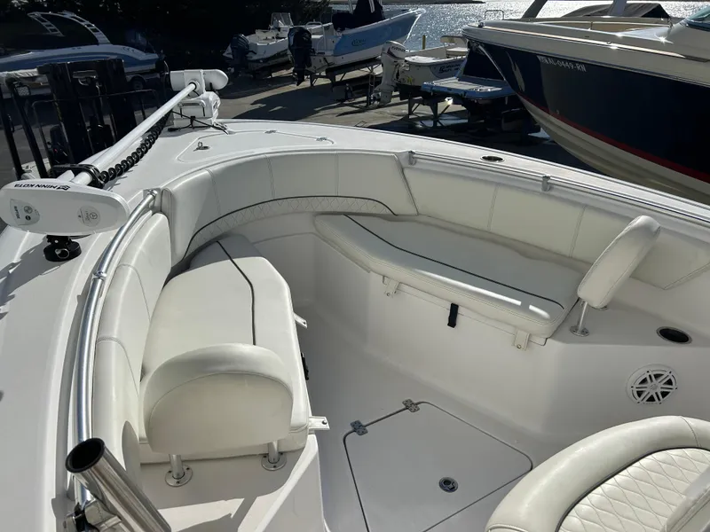 Slide: The Image of 2020 Sportsman Open 232 Center Console boat with white seating and spacious deck. - 15