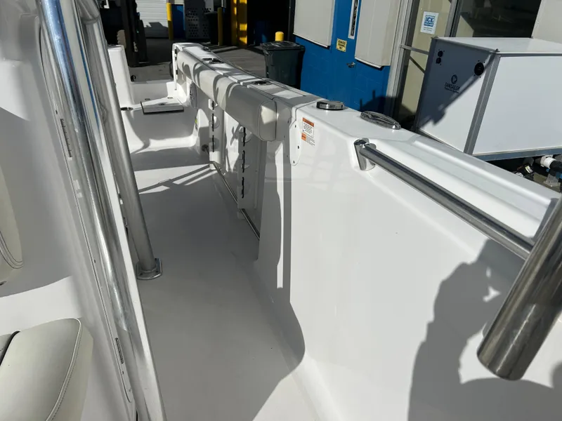 Slide: The Image of 2020 Sportsman Open 232 Center Console boat interior, featuring sleek white design and modern fittings. - 21