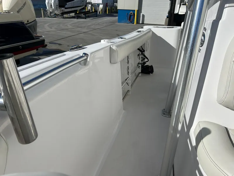 Slide: The Image of 2020 Sportsman Open 232 Center Console boat interior with seating and storage. - 22