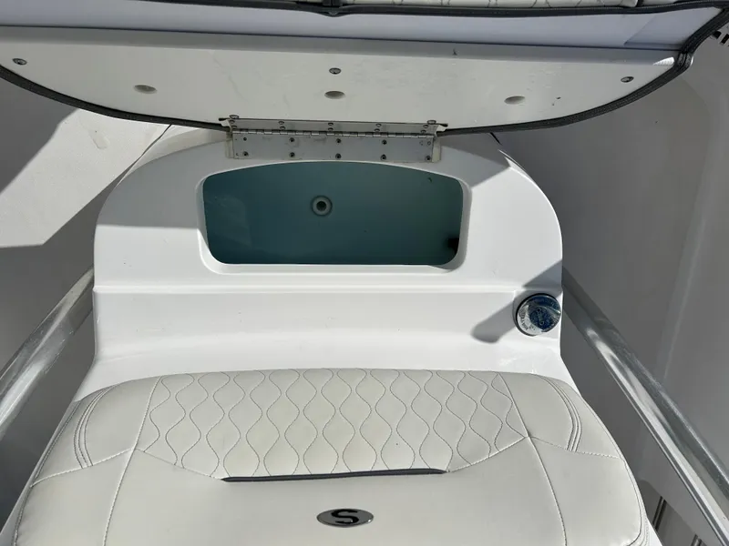Slide: The Image of 2020 Sportsman Open 232 Center Console boat interior with open storage compartment. - 25