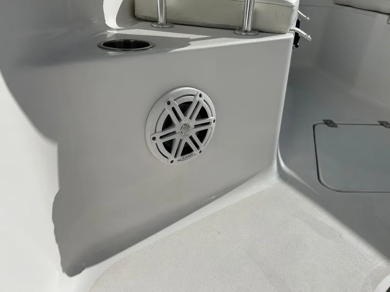 Slide: The Image of 2020 Sportsman Open 232 Center Console boat interior with speaker and cup holder. - 28