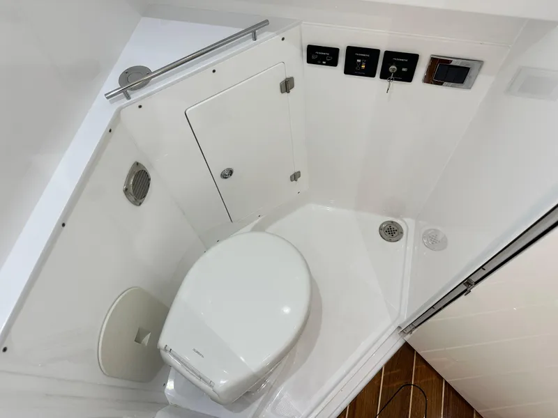 Slide: The Image of 2025 HCB 42 Lujo boat bathroom with modern fixtures and compact design. - 12