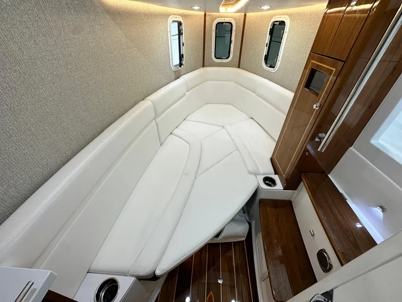 Slide: The Image of Luxurious interior of 2025 HCB 42 Lujo boat with elegant seating and wood accents. - 15