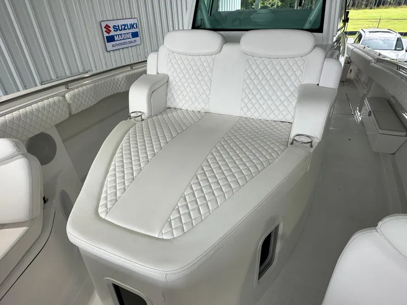Slide: The Image of Luxurious seating on 2025 HCB 42 Lujo boat with quilted white upholstery. - 20