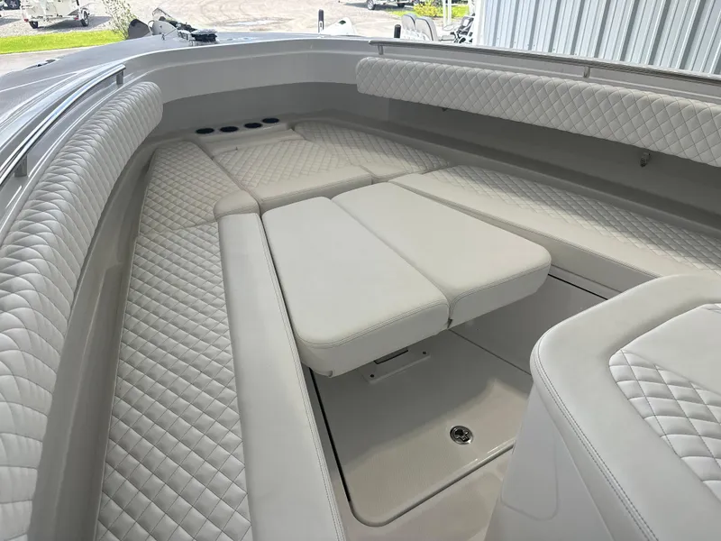 Slide: The Image of Luxurious seating area on the 2025 HCB 42 Lujo boat with quilted upholstery. - 9