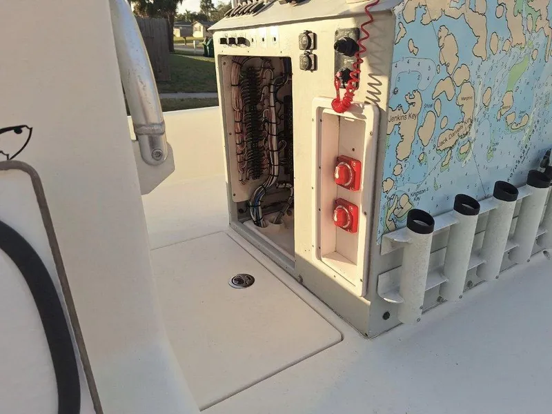 Slide: The Image of Bay Hawk 204 boat interior, 1992 model, featuring control panel and rod holders. - 12