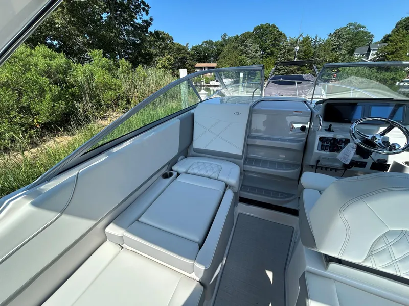 Slide: The Image of 2025 Regal 26 XO boat interior with luxurious seating and modern dashboard. - 9
