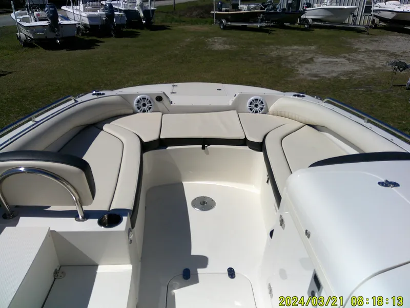 Slide: The Image of 2022 Stingray 212SC boat interior with spacious seating and modern design. - 11