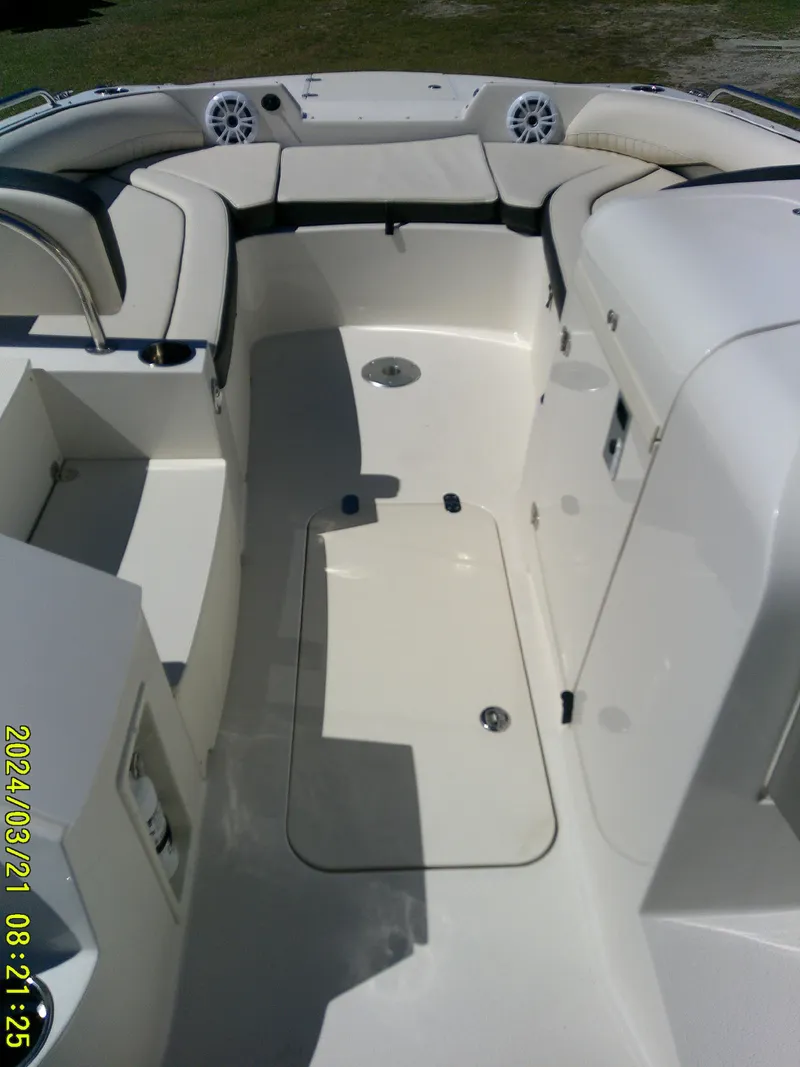 Slide: The Image of 2022 Stingray 212SC boat interior with spacious seating and storage compartments. - 25