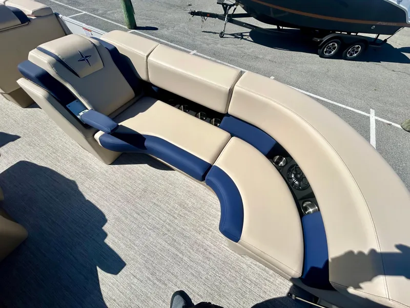 Slide: The Image of 2025 Berkshire 23CL STS 3.0 boat seating with beige and blue upholstery. - 10