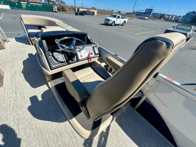Slide: The Image of 2025 Berkshire 23CL STS 3.0 boat interior with steering console and seating. - 13