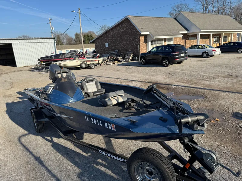 Slide: The Image of 2014 Polar Kraft Bass TX 175 Pro boat on trailer in parking lot. - 11