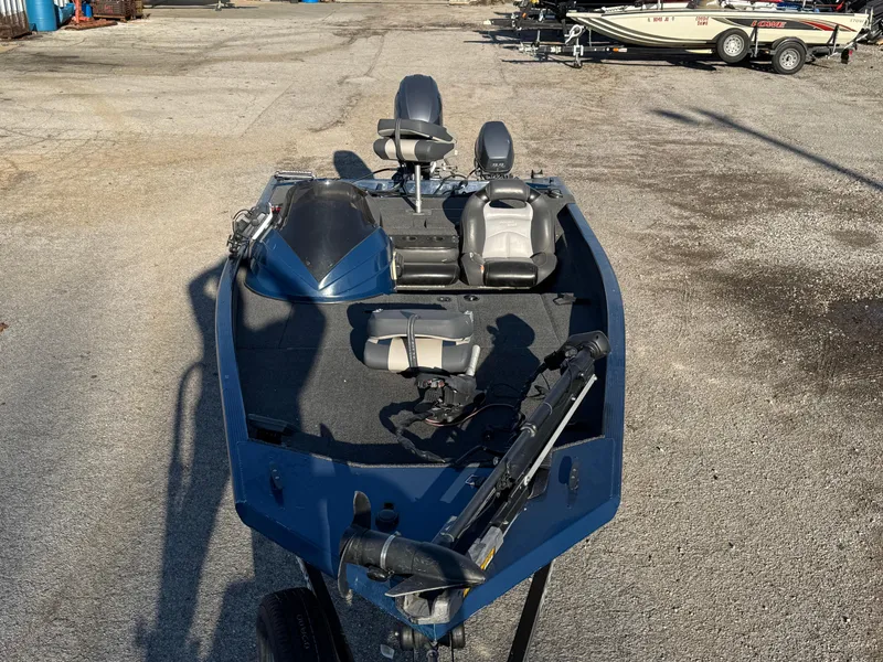 Slide: The Image of 2014 Polar Kraft Bass TX 175 Pro boat with seating and equipment on a trailer. - 12