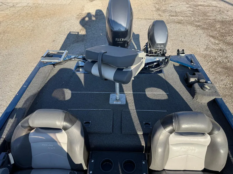 Slide: The Image of 2014 Polar Kraft Bass TX 175 Pro boat interior with seating and motor. - 15