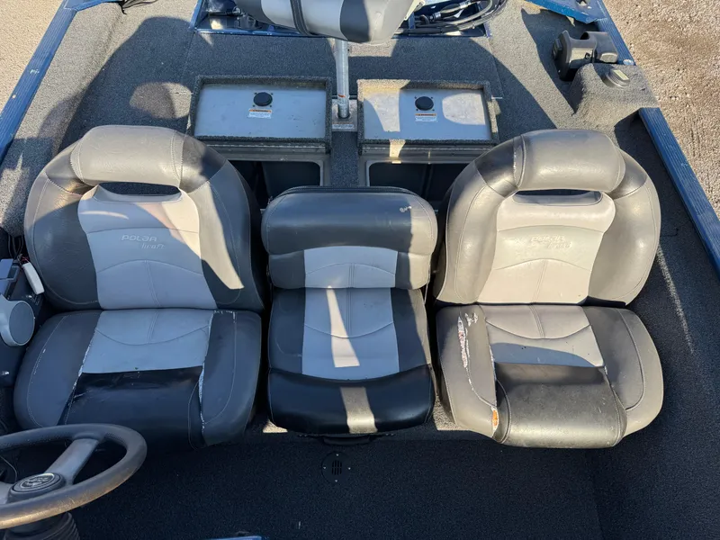 Slide: The Image of 2014 Polar Kraft Bass TX 175 Pro boat interior with three seats and storage compartments. - 16