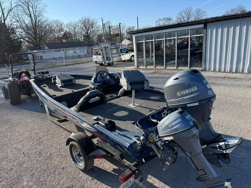 Slide: The Image of 2014 Polar Kraft Bass TX 175 Pro boat with Yamaha motor, parked outdoors. - 6