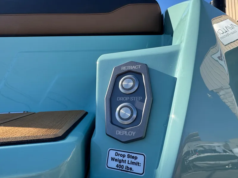 Slide: The Image of 2025 Supra SL 450 boat drop step controls with 400 lbs weight limit. - 12