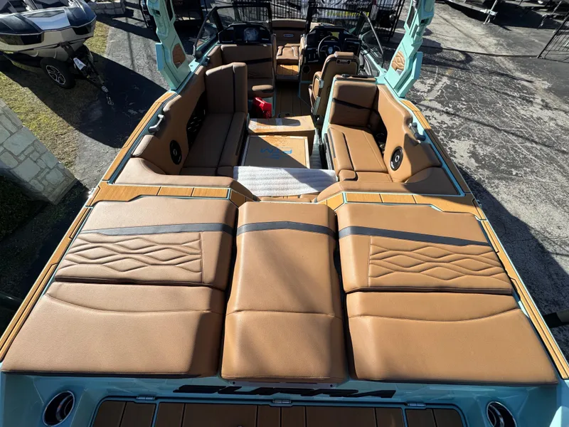 Slide: The Image of 2025 Supra SL 450 boat interior with tan leather seating and modern design. - 17