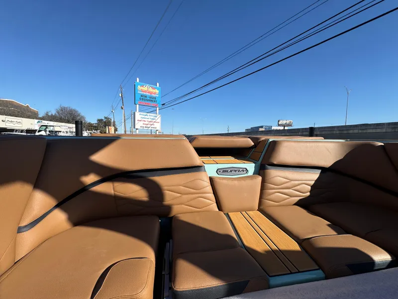 Slide: The Image of 2025 Supra SL 450 interior with tan leather seats and modern design. - 26