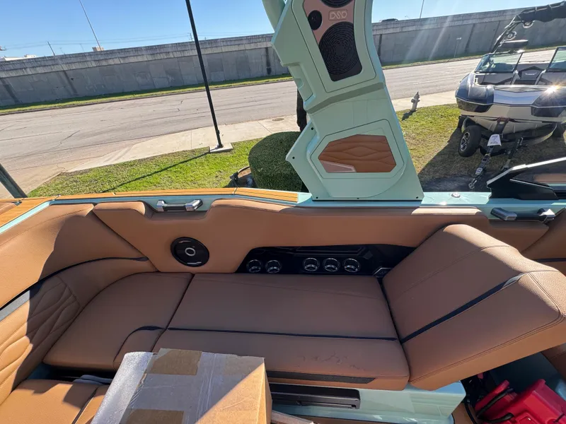 Slide: The Image of 2025 Supra SL 450 interior with tan leather seats and modern design elements. - 33