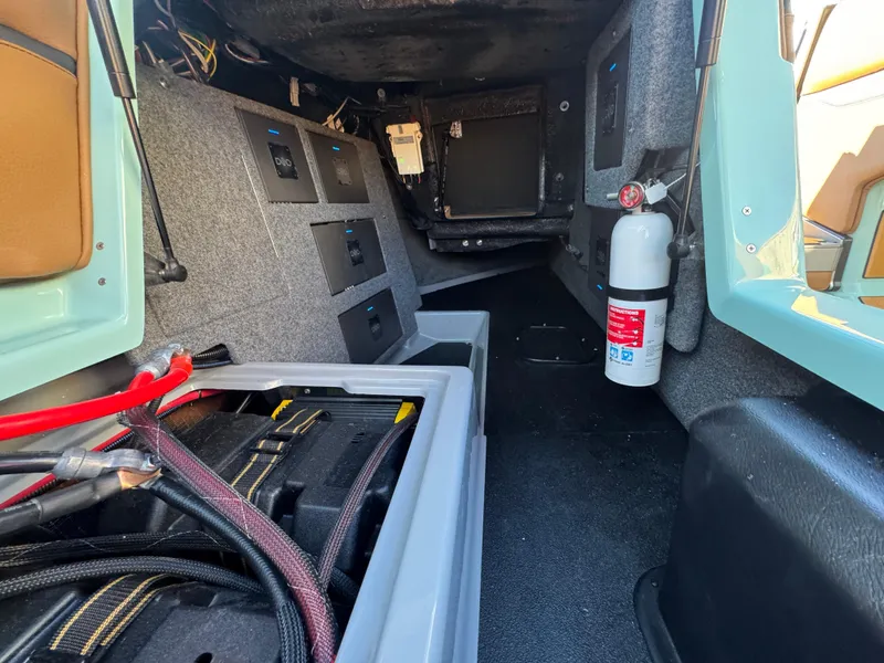 Slide: The Image of Interior view of 2025 Supra SL 450, showcasing storage compartments and safety equipment. - 35