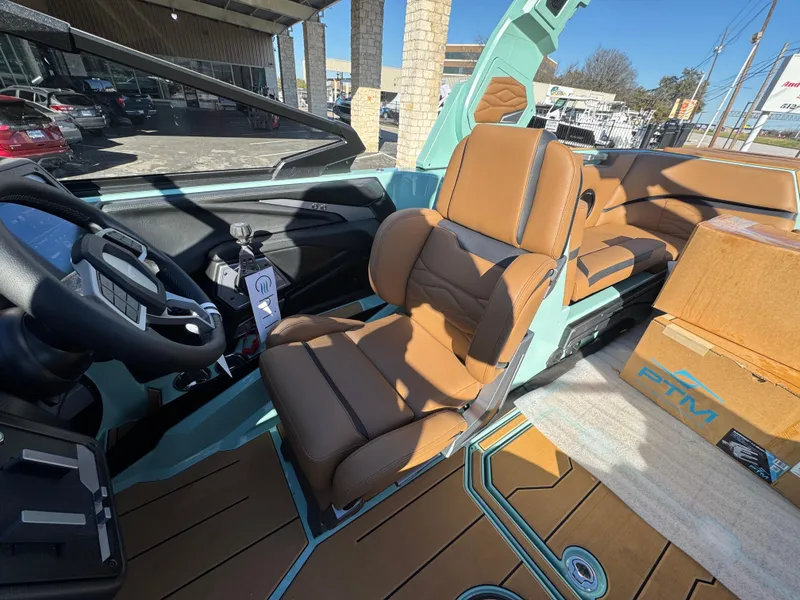 Slide: The Image of 2025 Supra SL 450 boat interior with tan leather seats and modern dashboard. - 38