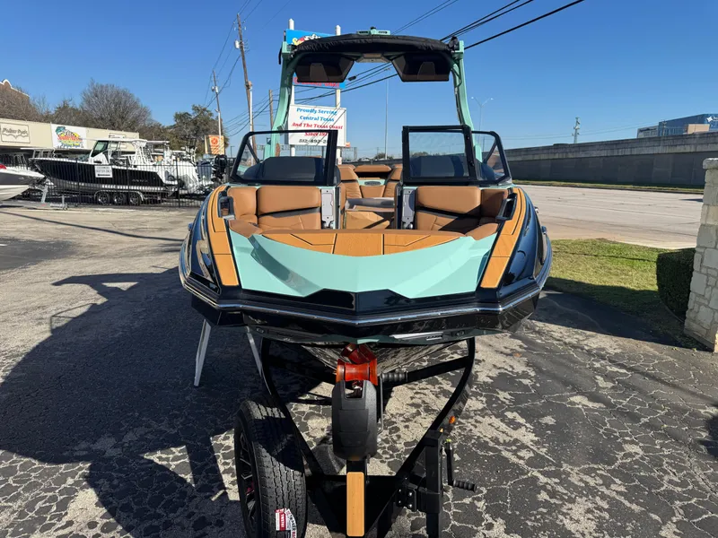 Slide: The Image of 2025 Supra SL 450 boat on trailer, featuring sleek design and modern seating. - 4